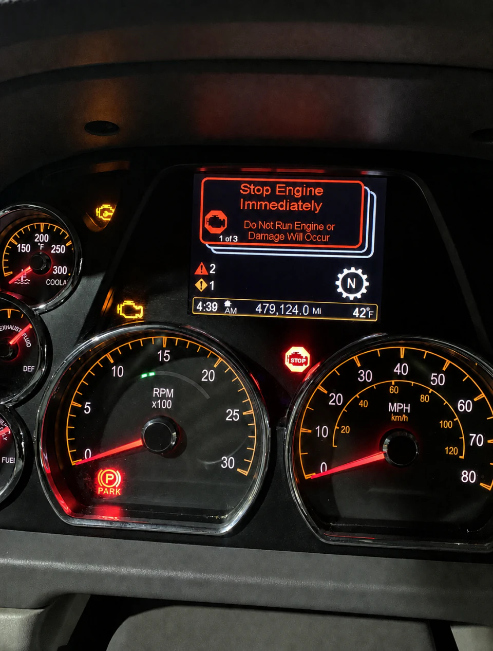 Heavy-duty truck dashboard displaying a stop-engine warning at Big Truck & Trailer Repair in Park City, Illinois